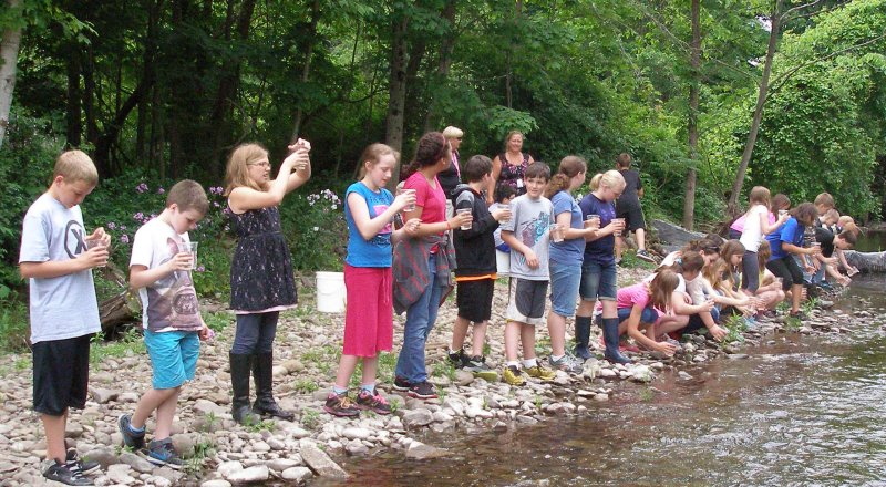 children lined up on the stream